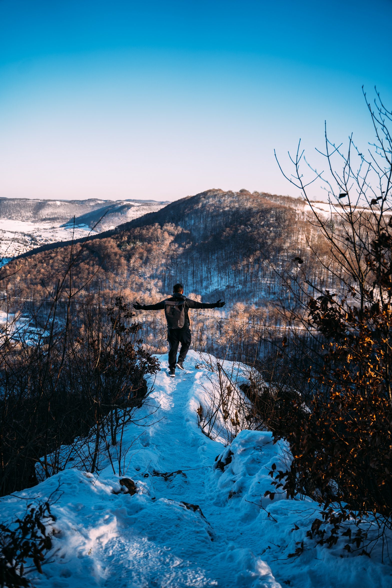 Man standing in front of a cliff